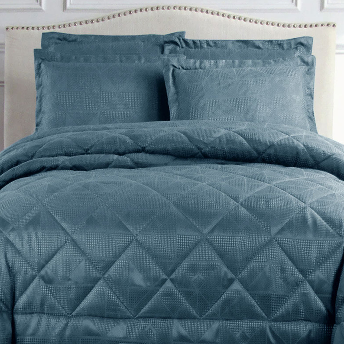 Hotel Living Eli Jacquard Comforter Set Queen Blue with diamond quilted geometric design on bed in bedroom setting