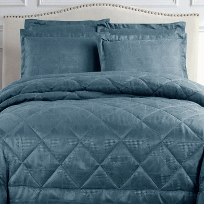 Hotel Living Eli Jacquard Comforter Set Queen Blue with diamond quilted geometric design on bed in bedroom setting