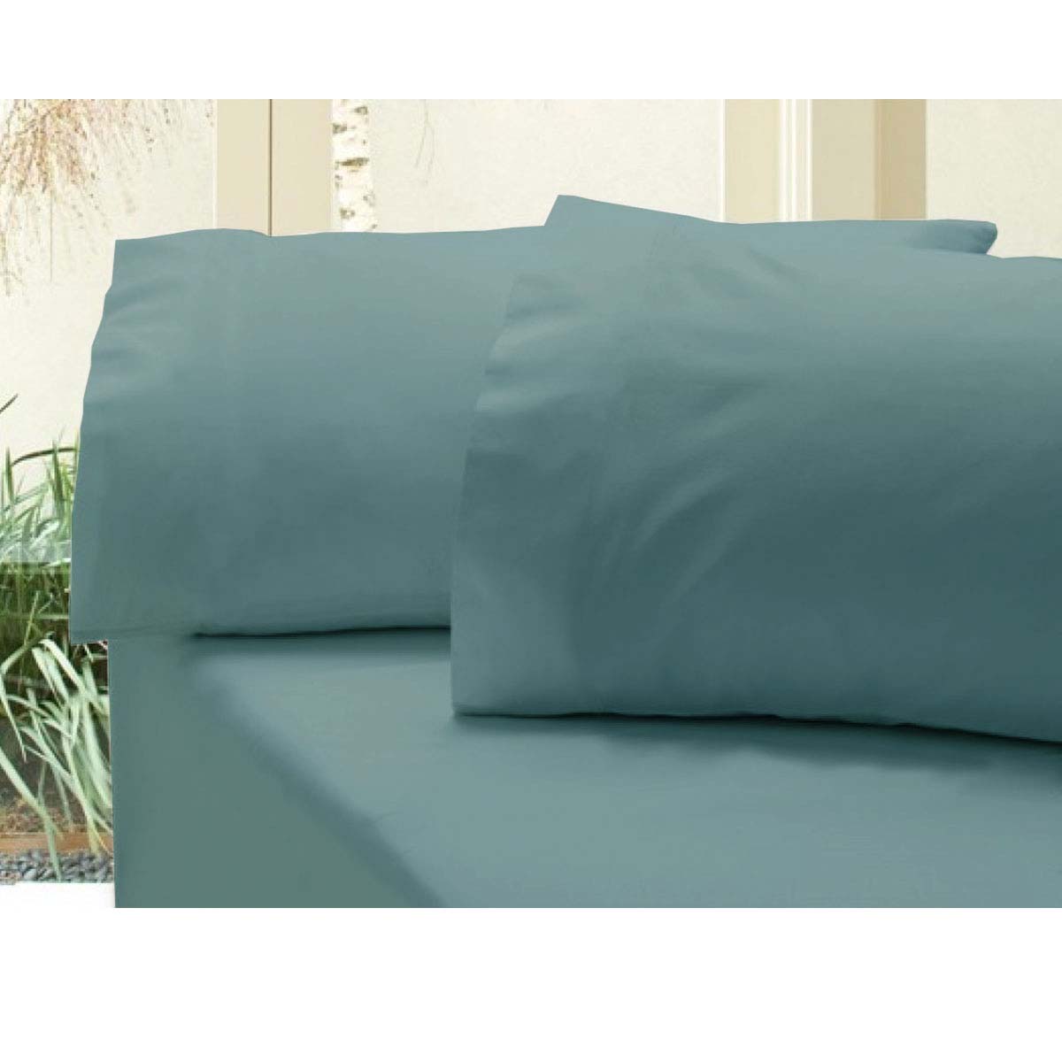 Revive 400TC Cotton Sateen Combo Set King Steel Blue fitted sheet set with matching pillowcases on bed by window