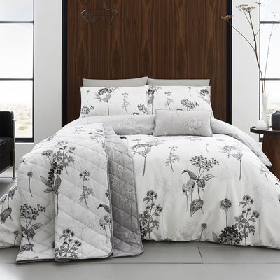 Coverley Grey Quilt Cover Set King with floral print, cotton rich fabric, displayed on styled bed with matching cushions and quilted blanket