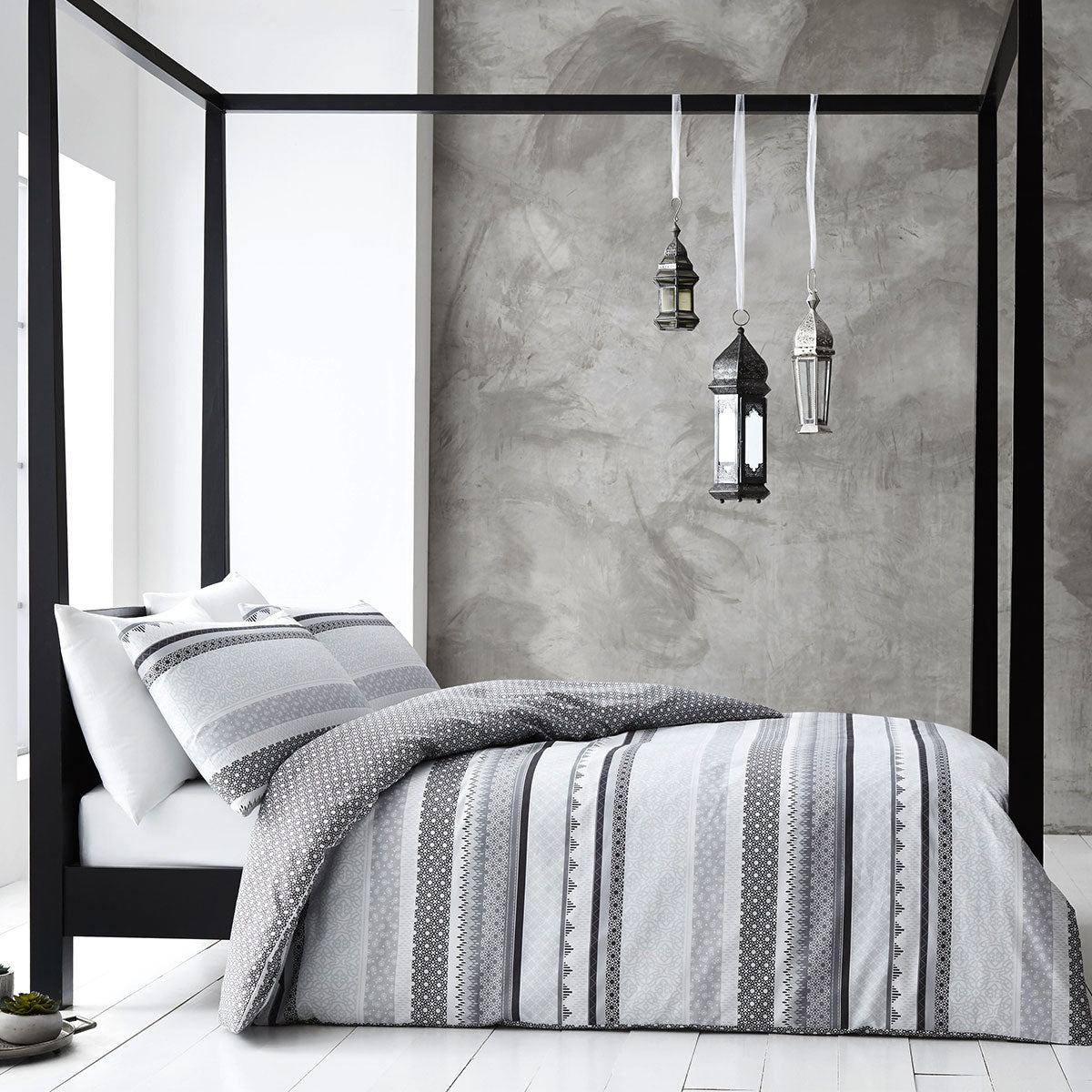 Gabrielle Grey Quilt Cover Set Queen with tribal pattern on bedzy bed in modern bedroom setting