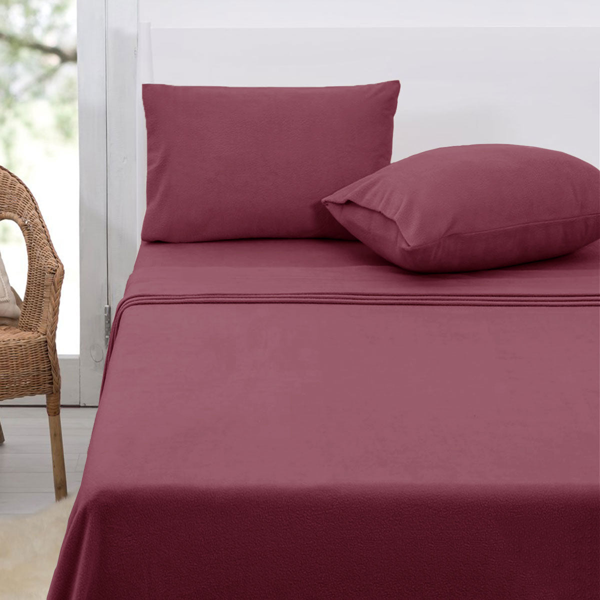 Polar Fleece Sheet Set Double 30cm Wall Rosewood in soft rosewood color on a bed with matching pillowcases in a bedroom setting