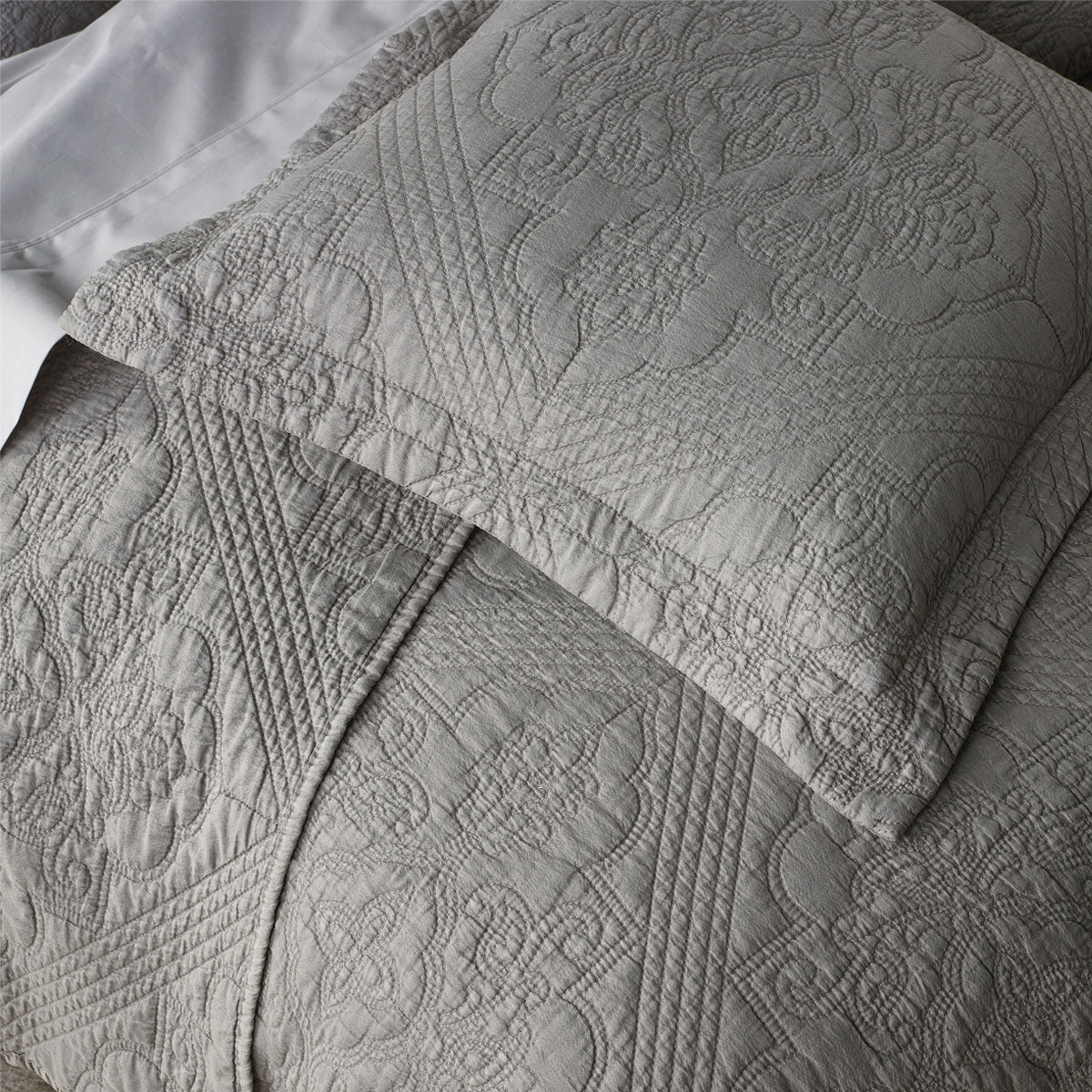 Bianca Zaria Taupe Embroidered Bedspread Set King with detailed medallion stitching on soft taupe fabric, styled on a bed.