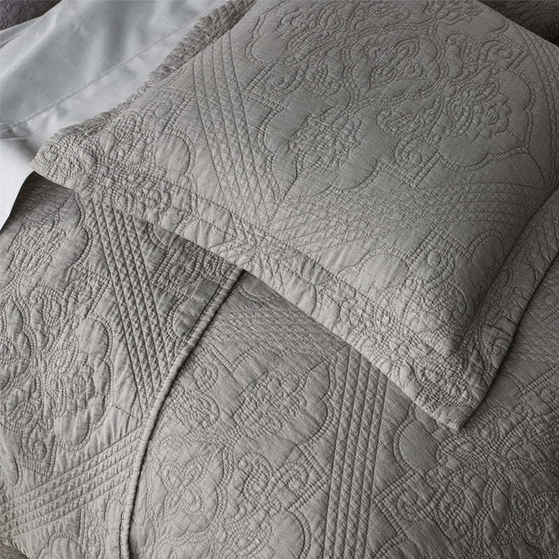 Bianca Zaria Taupe Embroidered Bedspread Set King with detailed medallion stitching on soft taupe fabric, styled on a bed.