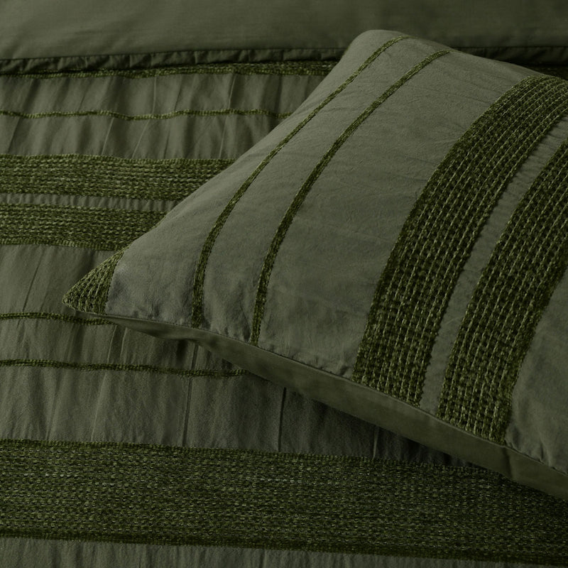 Close-up of the Bianca Avery Forest Chenille Striped Quilt Cover Set Queen in forest green with textured horizontal stripes.