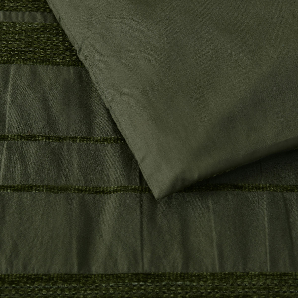 Close-up of Bianca Avery Forest Chenille Striped Quilt Cover Set Queen in forest green with soft chenille stripes by Bedzy