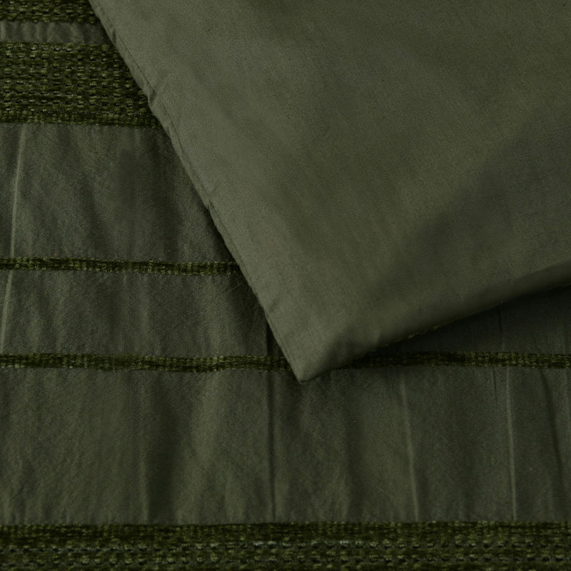 Close-up of Bianca Avery Forest Chenille Striped Quilt Cover Set Super King in forest green with soft chenille stripes.