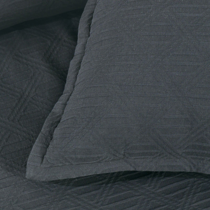 Close-up of Bianca Hallston Charcoal Pre-Washed Cotton Quilt Cover Set Queen featuring diamond jacquard pattern and tailored edges