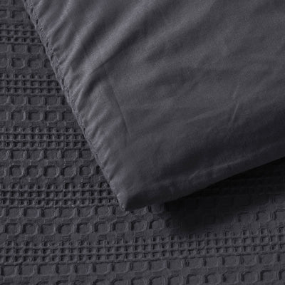 Bianca Kahlani Charcoal Waffle Quilt Cover Set Double showing textured waffle fabric and smooth charcoal pillowcase detail
