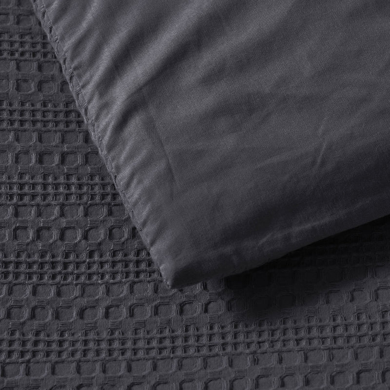 Bianca Kahlani Charcoal Waffle Quilt Cover Set Double showing textured waffle fabric and smooth charcoal pillowcase detail