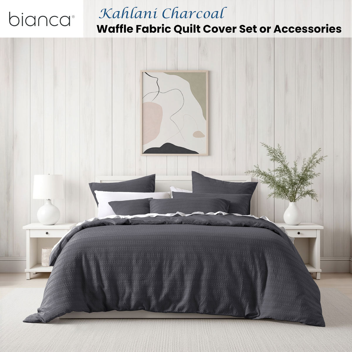 Bianca Kahlani Charcoal Waffle Quilt Cover Set King on bed with white bedside tables and modern artwork in bedroom