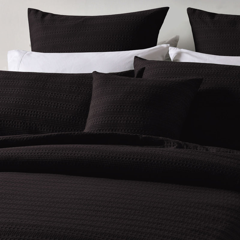 Bianca Kahlani Chocolate Waffle Quilt Cover Set Queen in chocolate with textured waffle fabric on bed with pillows