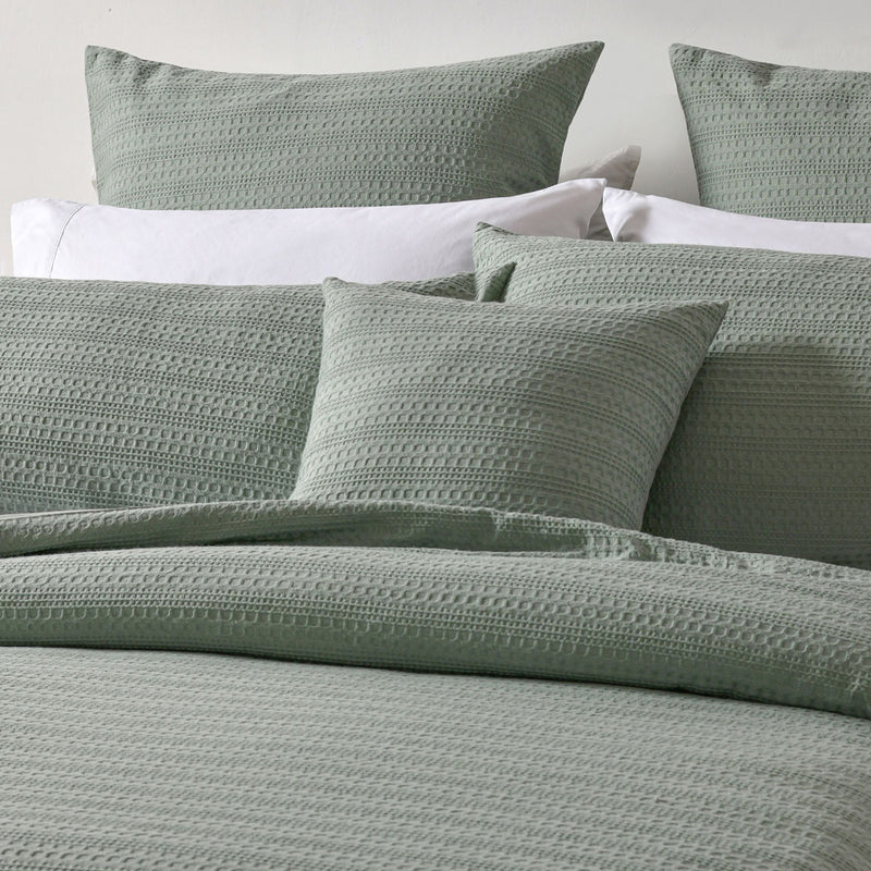 Bianca Kahlani Sage Waffle Quilt Cover Set Double with textured sage waffle fabric and matching pillowcases on bed
