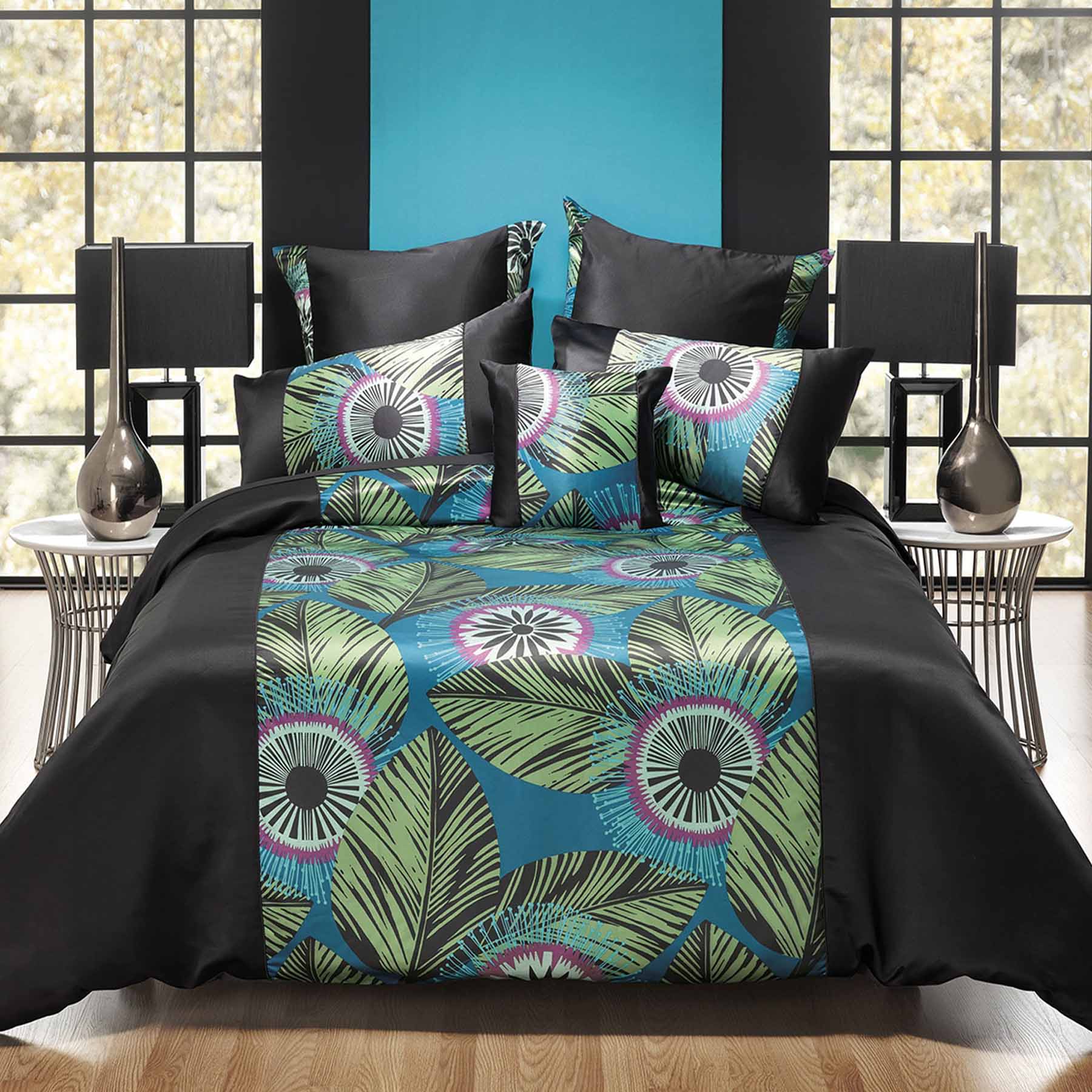 Black Quilt Cover Set Queen with vibrant jungle print, featuring green, pink, and blue tones with black piped border on bed.