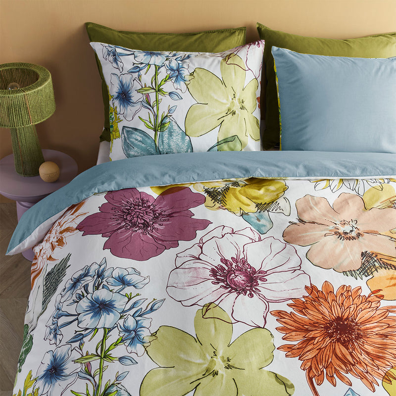 Bedding House Lotti Multi Cotton Floral Quilt Cover Set King with vibrant flower prints and blue and green pillowcases on bed