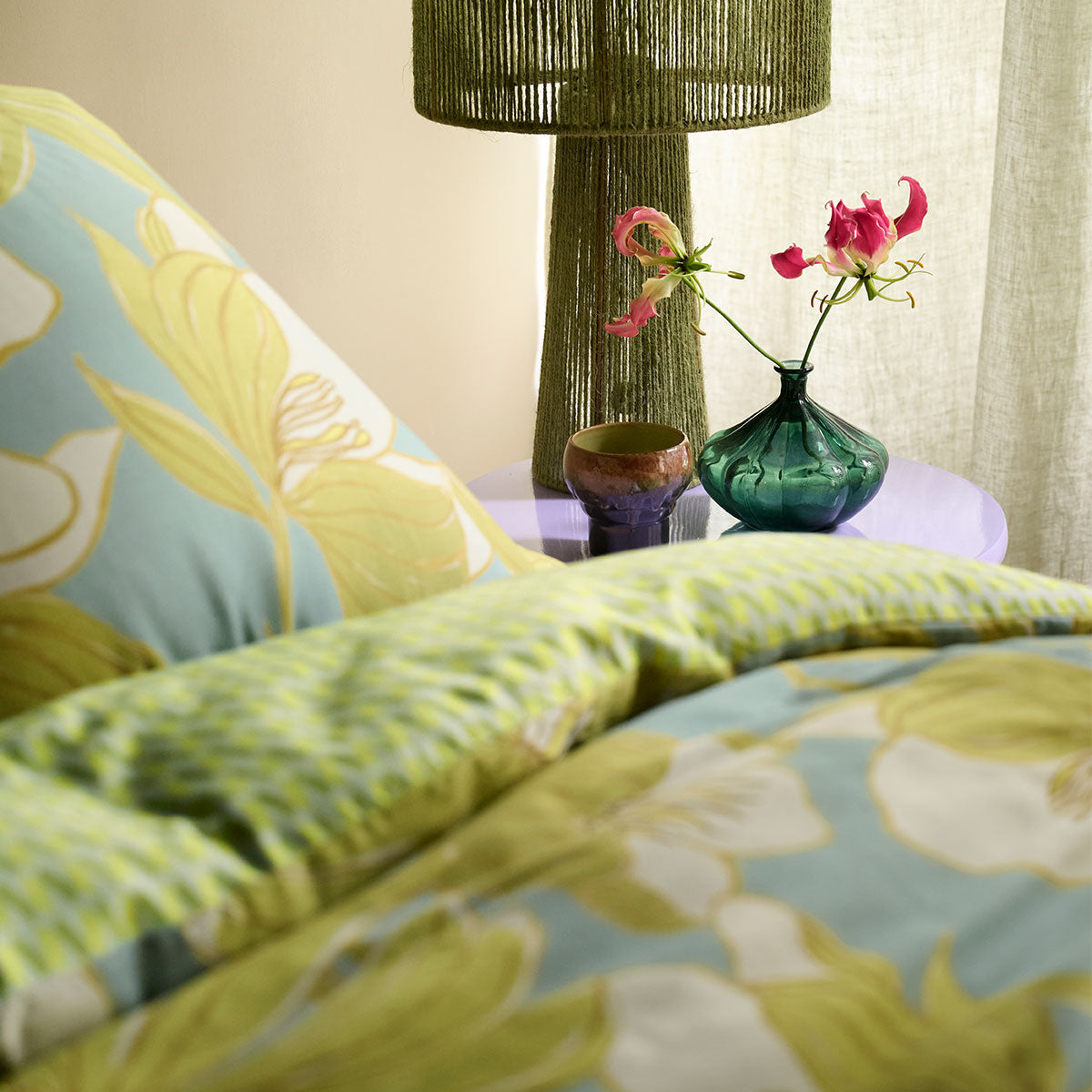 Oilily Melodi Green Cotton Floral Quilt Cover Set Queen on bed with green lamp and floral vase on side table