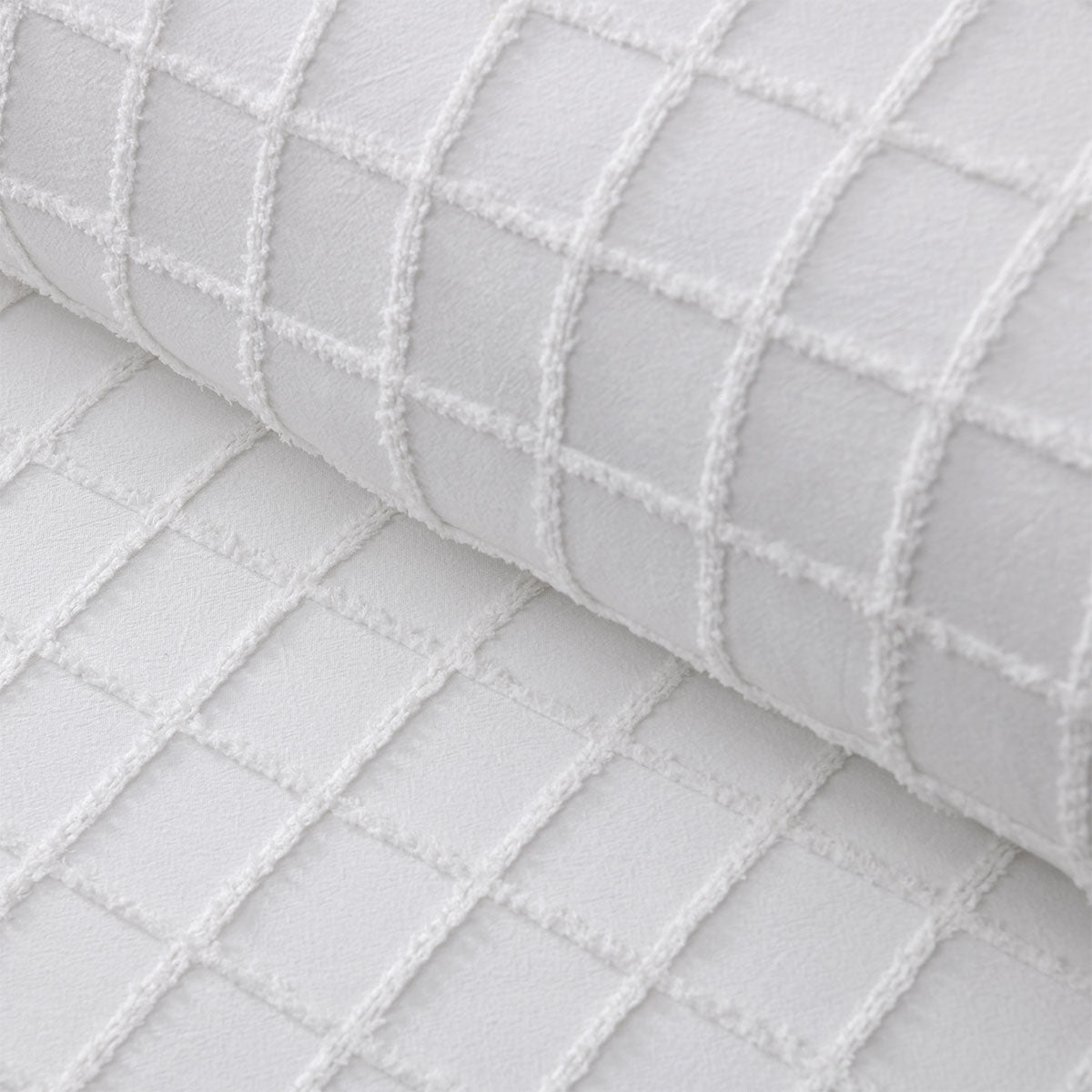 Close-up of textured white cotton fabric with a grid pattern on Vintage Design Homewares Parquet White Cotton Quilt Cover Set King