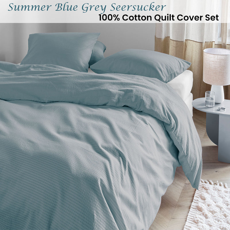 Bedding House Summer Blue Grey Seersucker Cotton Quilt Cover Set King on bed in bright bedroom with lamp and side table