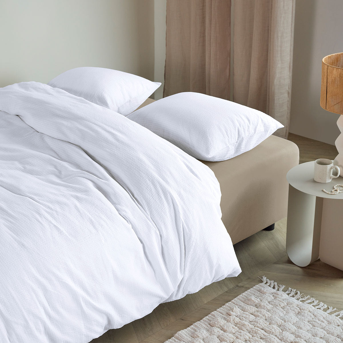 Bedding House Summer White Seersucker Cotton Quilt Cover Set King on beige bed with pillows and light wood flooring