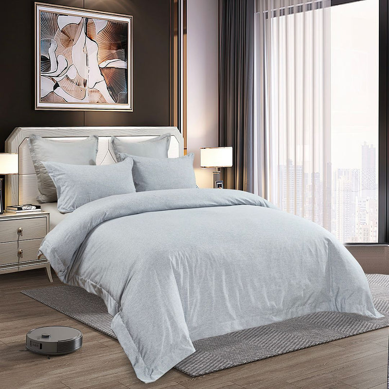 Tailored Super Soft Quilt Cover Set - King Size in light gray on styled bed with modern bedroom furniture and city view window