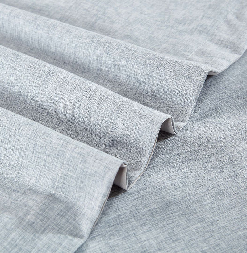 Close-up of gray textured fabric from the Tailored Super Soft Quilt Cover Set - Queen Size by Bedzy for bedroom furniture.