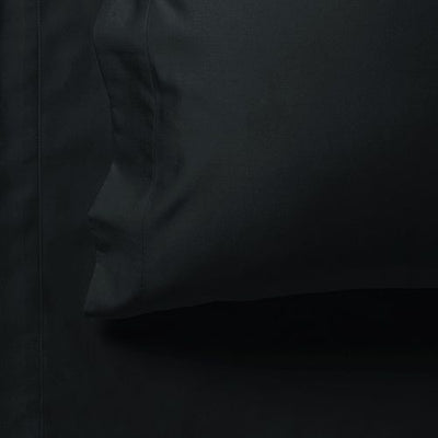 Close-up of black pillow and sheet from 1000TC Ultra Soft Queen Size Bed Black Flat & Fitted Sheet Set by Bedzy