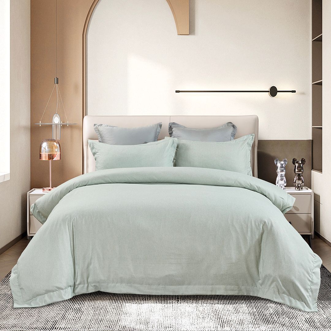 Tailored Super Soft Quilt Cover Set - Super King Size in soft pastel green displayed on modern bed with bedside tables and decor