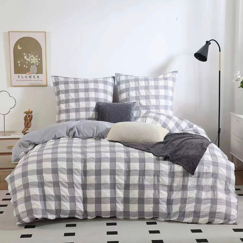 Rylee Grey Check Seersucker Quilt Cover Set - Queen Size on bed with pillows, bedside table, and floor lamp in bedroom setting