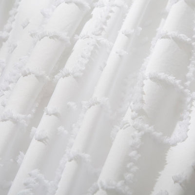 Close-up of textured white fabric from Tufted Boho Embroidery Quilt/Doona/Duvet Cover Set - White - Queen Size by Bedzy