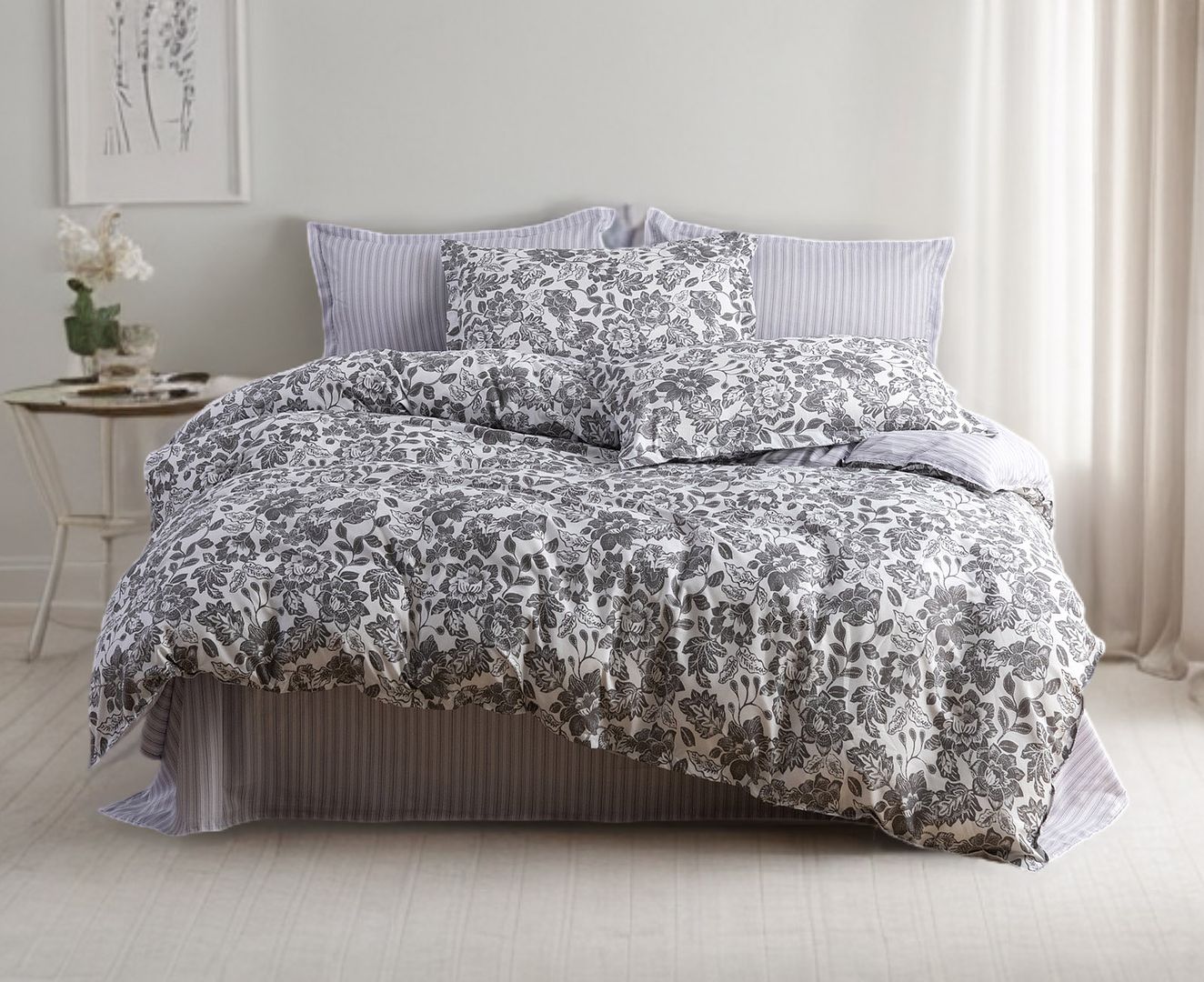 Matira Quilt Cover Set - Queen Size with floral and striped patterns on a neatly made bed in a bright bedroom setting