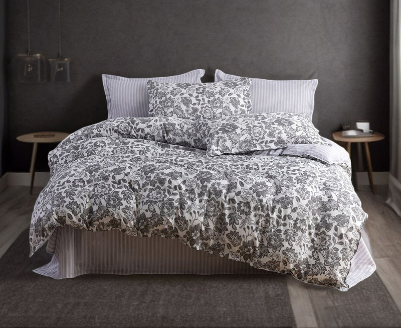 Matira Quilt Cover Set - Queen Size with floral patterned duvet and striped pillows in modern bedroom setting