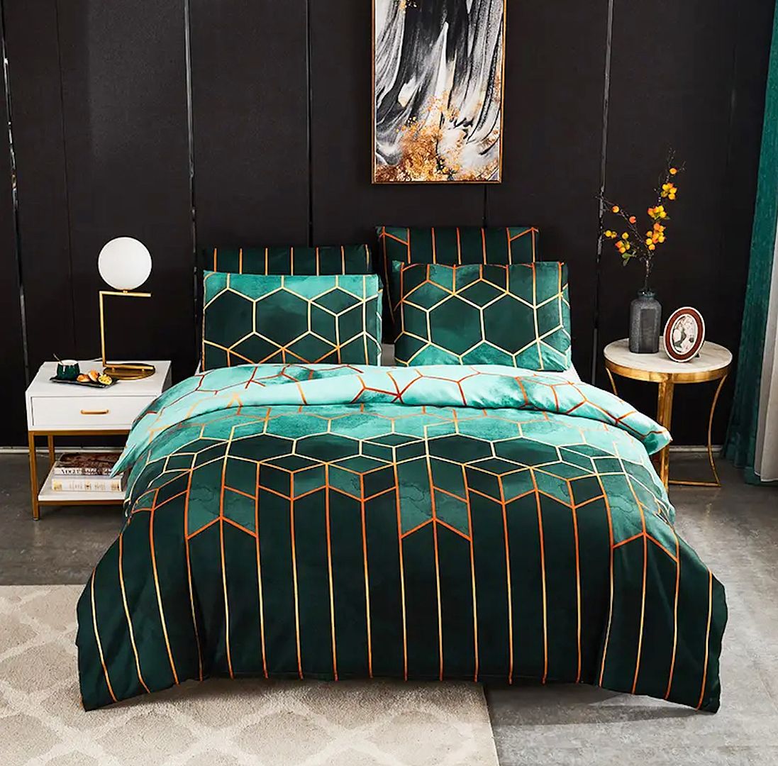 Giverny Quilt Cover Set - Queen Size with geometric green and gold pattern displayed on bed with bedside tables and decor
