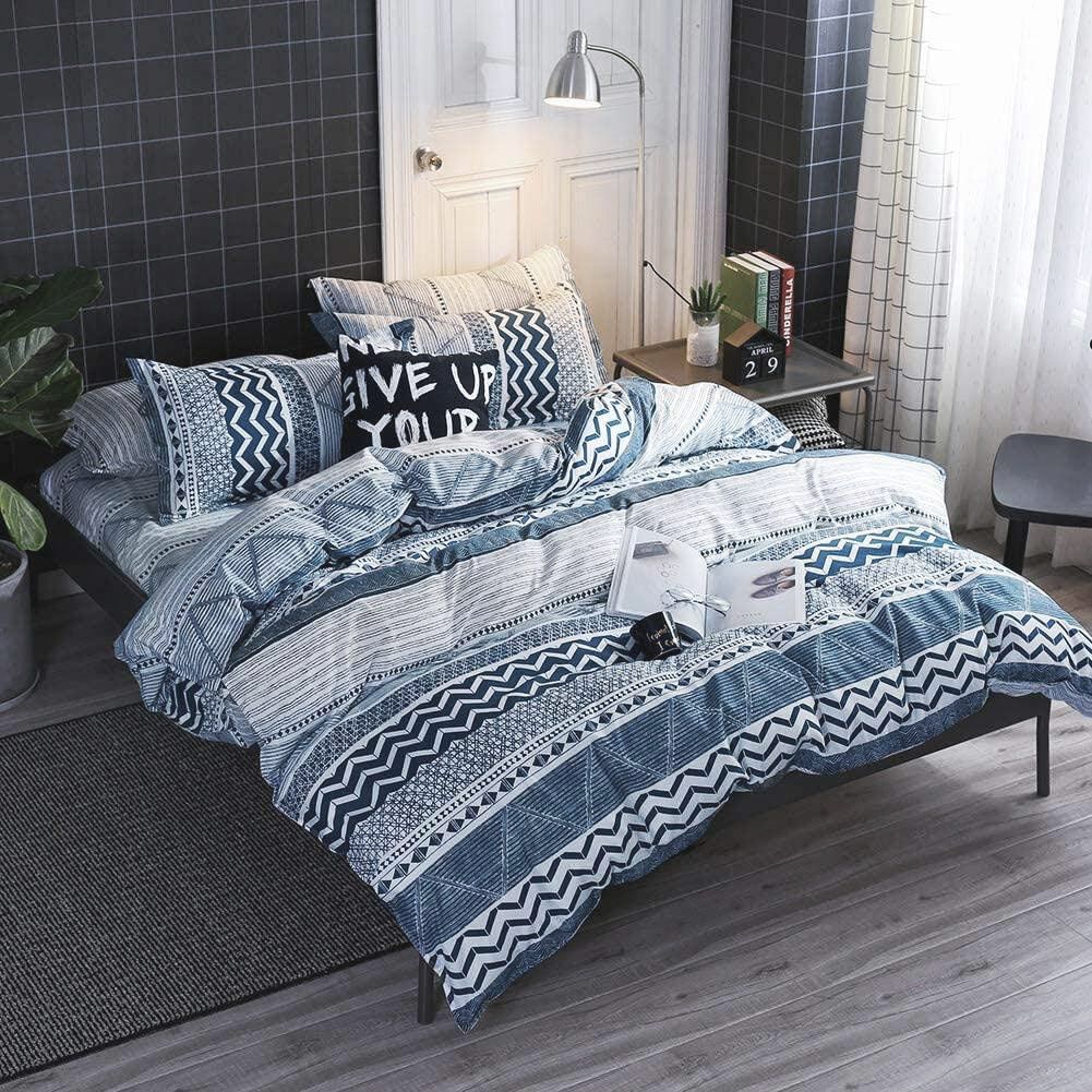 Dennings Super King Size Quilt/Doona/Duvet Cover Set in blue and white with geometric patterns on a styled bed in a modern bedroom.