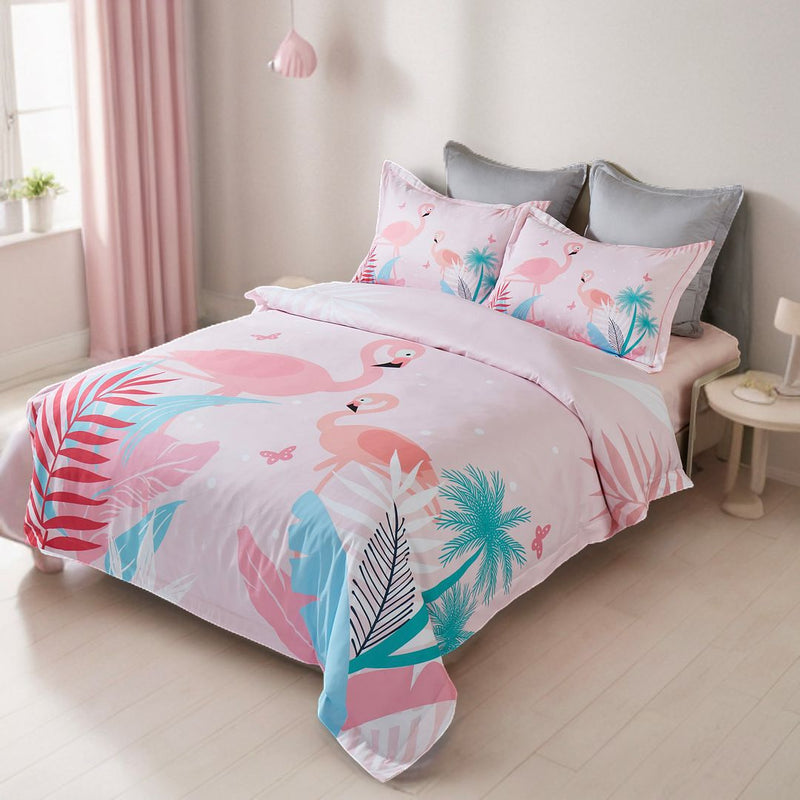 Flamingo Kids Quilt Cover Set - Double Size with pink flamingo and tropical leaf print on double bed in bright bedroom setting