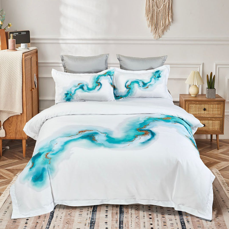 Ocean Marble Quilt Cover Set - King Size on bed with blue marble pattern, pillows, wooden bedside tables, and room decor.