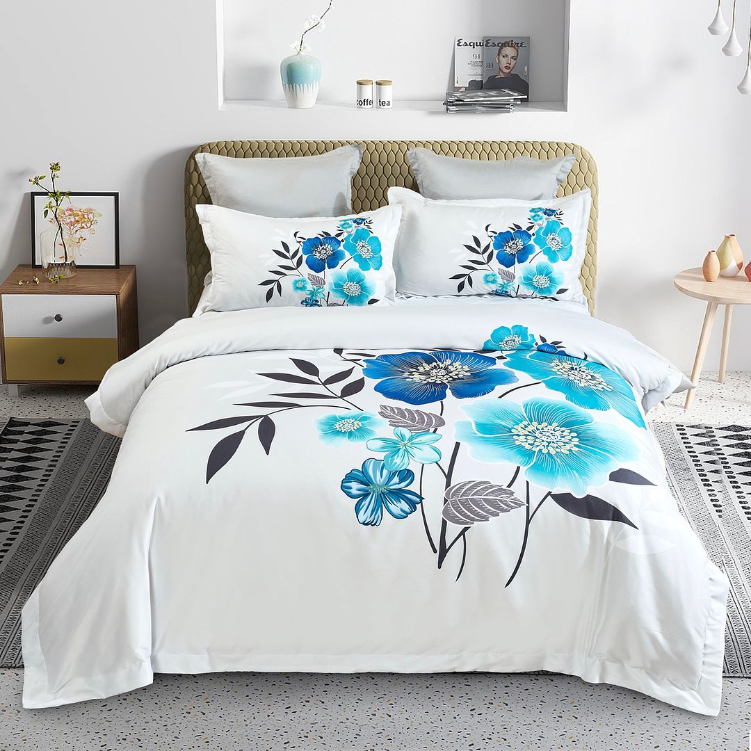Braithe Floral Quilt Cover Set - King Size with blue floral design, neatly arranged on a beige bed frame in a modern bedroom setting