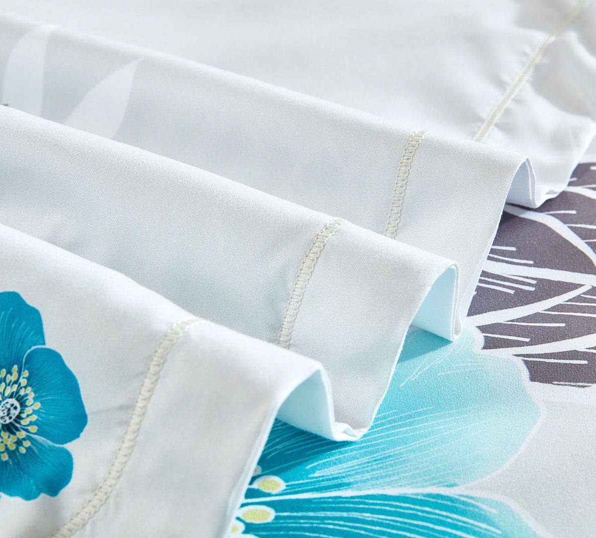 Close-up of Braithe Floral Quilt Cover Set - King Size showing detailed stitching and blue floral pattern on white fabric