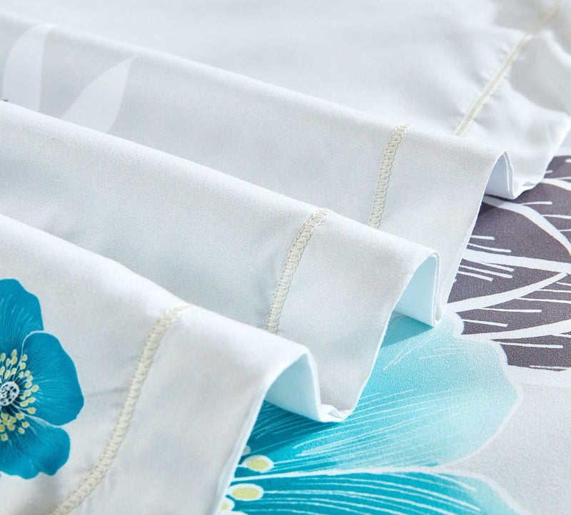 Close-up of Braithe Floral Quilt Cover Set - King Size showing detailed stitching and blue floral pattern on white fabric