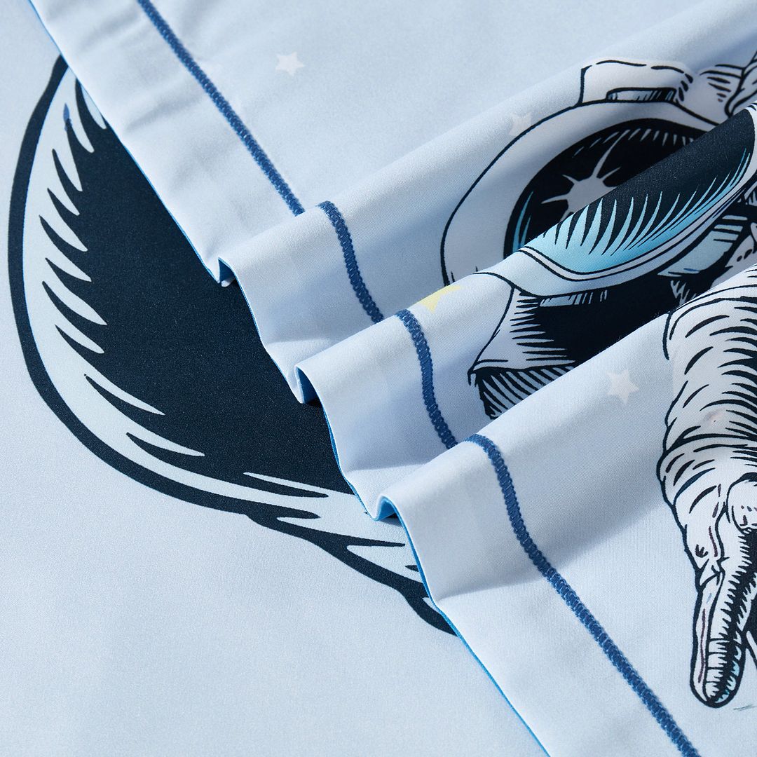 Close-up of Astronaut Kids Quilt Cover Set - King Single Size showing astronaut and star print on blue bedding by Bedzy