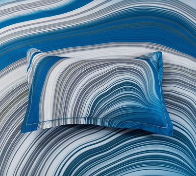 Evienne Quilt Cover Set - Queen Size in blue and gray swirl pattern on pillow and bedding by Bedzy