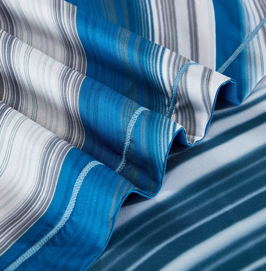 Close-up of striped blue and gray fabric detailing on the Evienne Quilt Cover Set - Queen Size for bedroom bedding.