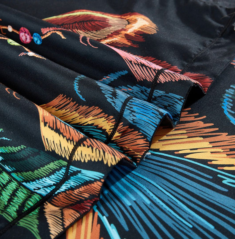 Close-up of colorful feather patterns on black fabric from the Dream Catcher Quilt Cover Set - Queen Size by Bedzy