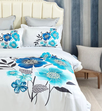 Braithe Floral Quilt Cover Set - Queen Size featuring large blue and teal flowers on white bedding in a bedroom setting