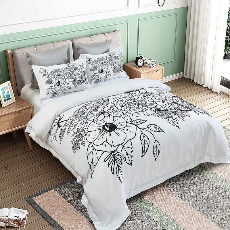 Viene Floral Quilt Cover Set - Queen Size with black floral design on white bedding in a modern bedroom setting