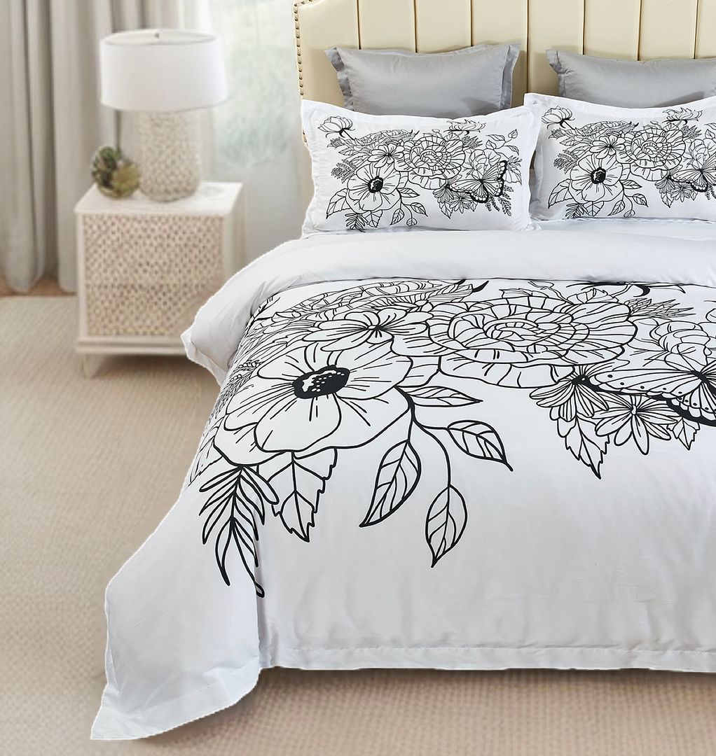 Viene Floral Quilt Cover Set - Queen Size with black and white floral design on bed in modern bedroom setting
