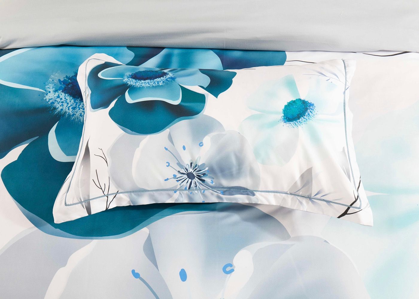 Julieta Floral Quilt Cover Set - Queen Size with blue and white large floral pattern pillow and quilt cover detail