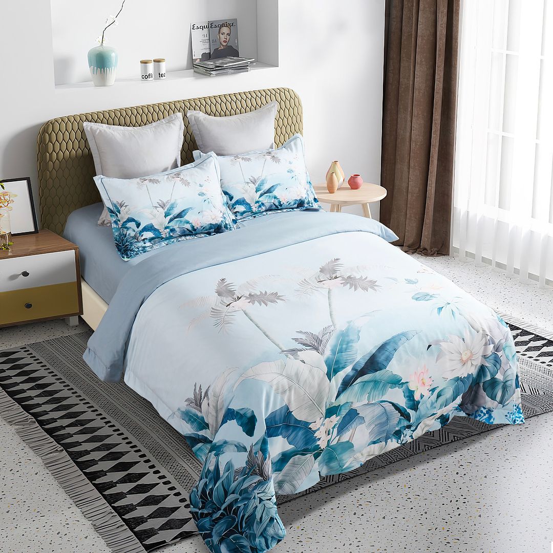 Tropical Quilt Cover Set - Queen Size with blue and white botanical print on a styled bed in modern bedroom setting