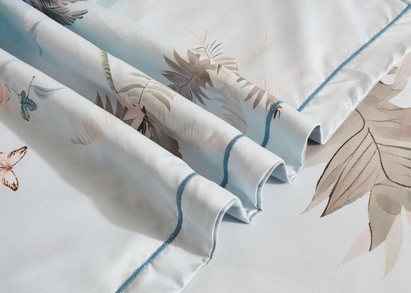 Tropical Quilt Cover Set - Queen Size with subtle botanical print and blue piping detail on soft fabric by Bedzy