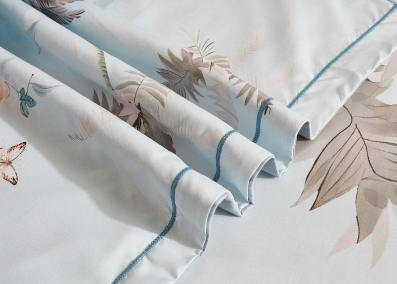 Tropical Quilt Cover Set - Queen Size with subtle botanical print and blue piping detail on soft fabric by Bedzy