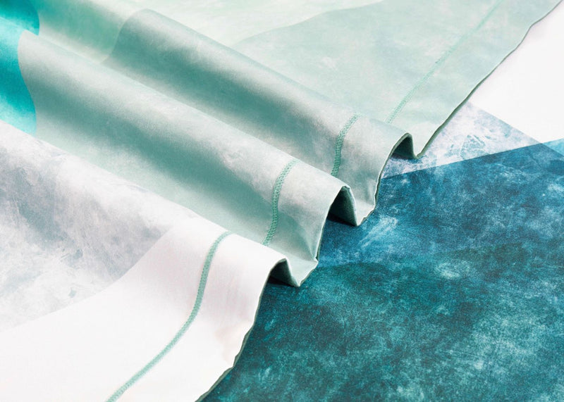 Close-up of teal and white fabric folds from the Takashi Quilt Cover Set - Queen Size by Bedzy